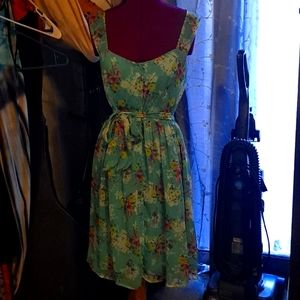 Adorable flowered summer dress. Teal with purple,yellow, and pink flowers.